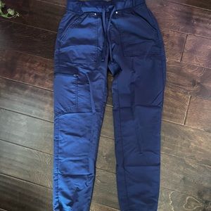 An indigo scrub that’s comfortable to where for hours. Barely worn. Size x-small